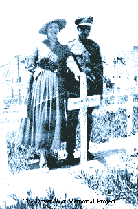 WJ Mack, two people at his grave, courtesy Kevin Toulson