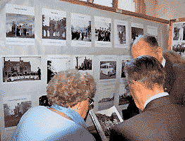 people looking at the exhibition, by Simon Chambers