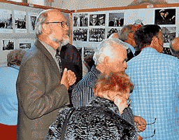 people looking at the exhibition, by Simon Chambers