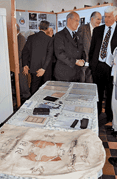 people looking at the exhibition, by Simon Chambers