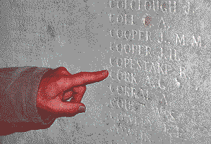 John's finger pointing at name