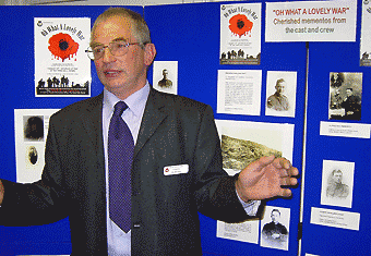 Councillor Vic Matcham beside a display board