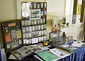 a display of ration books and other artefacts, and grave pictures