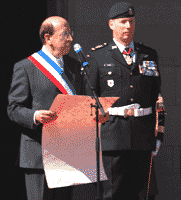 the French Mayor reads aloud the proclamation from a large document