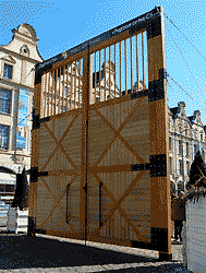 two six metere wooden gates, especially erected,  in the centre of the place des heroes