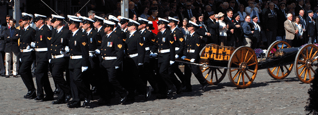 drawing the large gun behind them