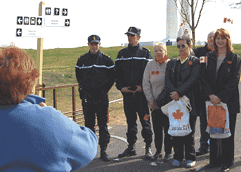 visitros having their photo taken with gendarmes