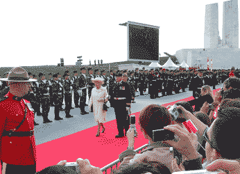 inspecting the troops, the Vimy Memorial in the background